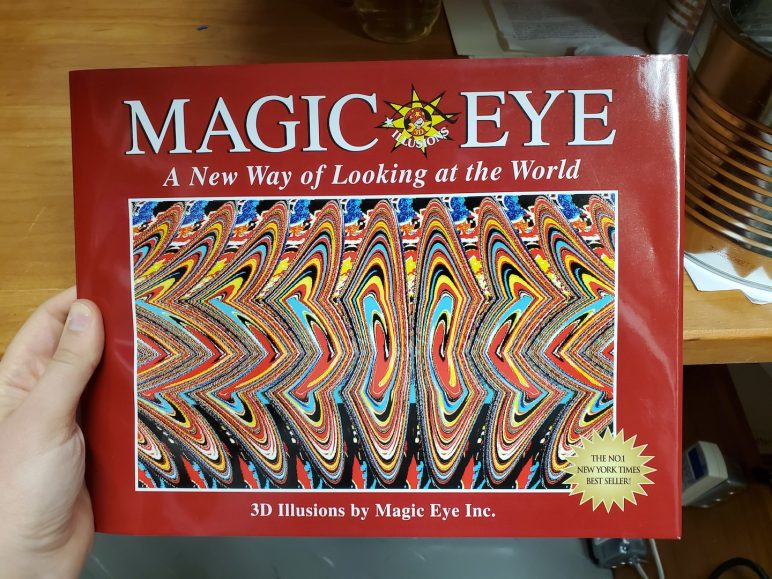 Magic Eye Puzzles book cover. Cover has a magic eye puzzle and the words, "Magic Eye, a new way of looking at the world."