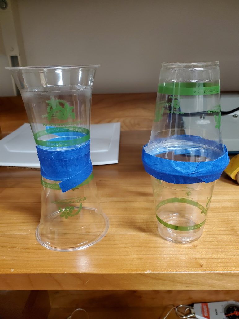 Cups used for demo. Two sets of cups taped in different ways.